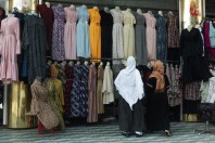 Women choosing clothes, Kabul
